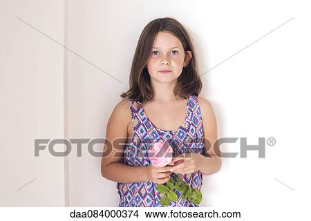 Picture - Girl holding rose, portrait. Fotosearch