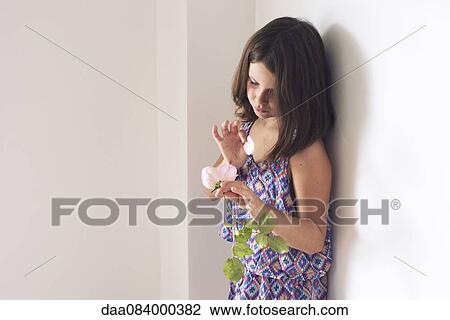 Girl picking petals from rose View Large Photo Image Stock Image - Girl picking petals from rose. Fotosearch