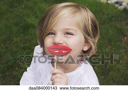 Little girl wearing costume lips View Large Photo Image Stock Image - Little girl wearing costume lips. Fotosearch