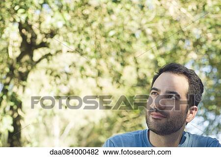 Man daydreaming outdoors View Large Photo Image Stock Image - Man daydreaming outdoors. Fotosearch