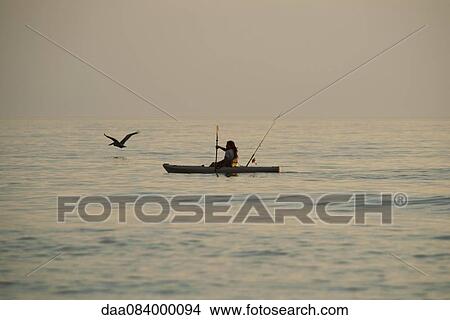 Man kayaking in sea View Large Photo Image Picture - Man kayaking in sea. Fotosearch