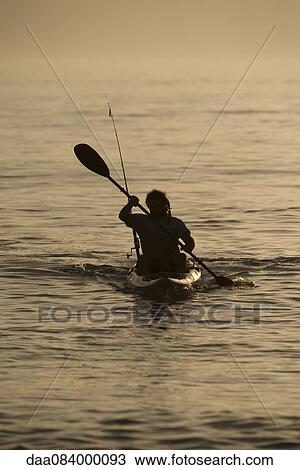 Stock Image - Man kayaking. Fotosearch