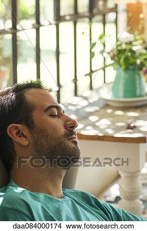 Man napping at home View Large Photo Image Picture - Man napping at home. Fotosearch
