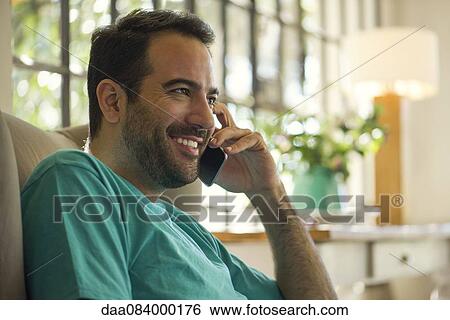 Man on phone call View Large Photo Image Stock Photograph - Man on phone call. Fotosearch