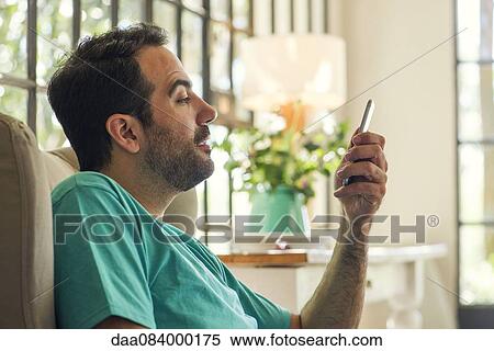 Man using smartphone View Large Photo Image Stock Photography - Man using smartphone. Fotosearch