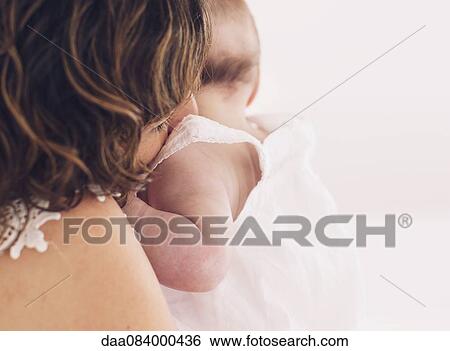 Stock Photograph - Mother holding baby. Fotosearch