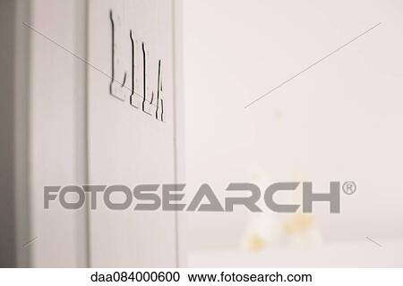 Stock Image - Name on door to baby's room. Fotosearch