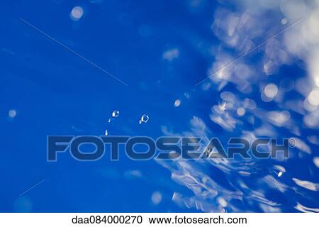 Stock Image - Rippled, blue water, close-up. Fotosearch