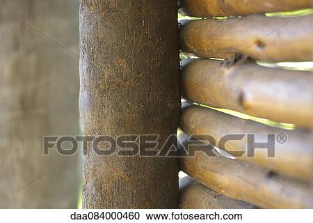 Stock Image - Rustic bamboo fence, close-up. Fotosearch