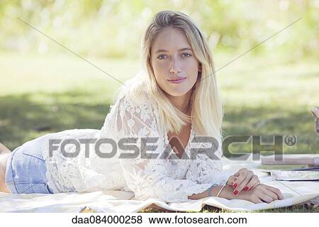 Woman daydreaming in park View Large Photo Image Stock Photo - Woman daydreaming in park. Fotosearch