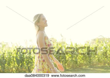 Stock Photo - Woman enjoying outdoors. Fotosearch