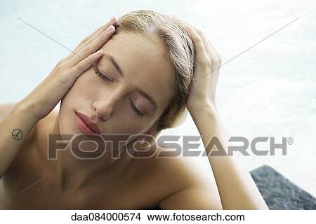 Woman relaxing in pool View Large Photo Image Picture - Woman relaxing in pool. Fotosearch