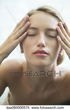 Woman relaxing in pool with eyes closed View Large Photo Image Stock Photography - Woman relaxing in pool with eyes closed. Fotosearch