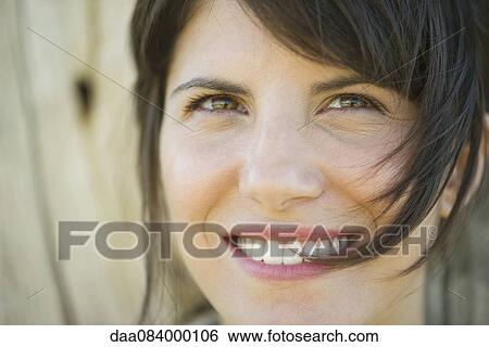 Woman smiling cheerfully, portrait View Large Photo Image Stock Photograph - Woman smiling cheerfully, portrait. Fotosearch