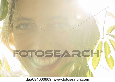 Stock Photo - Woman smiling, portrait. Fotosearch