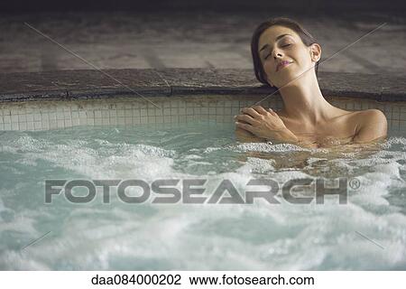Woman soaking in spa pool View Large Photo Image Stock Image - Woman soaking in spa pool. Fotosearch