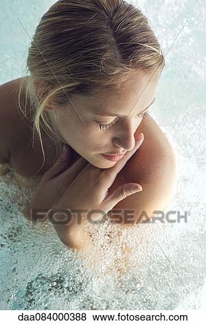 Woman soaking in spa pool View Large Photo Image Stock Photo - Woman soaking in spa pool. Fotosearch