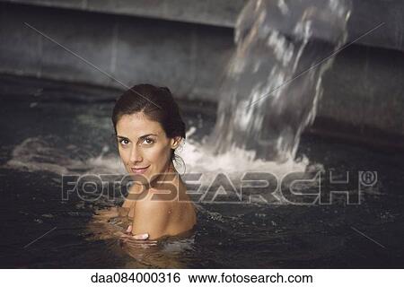 Woman soaking in spa pool View Large Photo Image Stock Photograph - Woman soaking in spa pool. Fotosearch