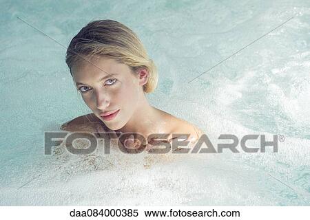 Woman soaking in spa pool View Large Photo Image Stock Photography - Woman soaking in spa pool. Fotosearch