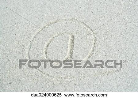 At symbol traced in sand, close-up View Large Photo Image Stock Photography - At symbol traced in sand, close-up. Fotosearch
