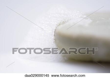 Bar of soap and soap suds, close-up View Large Photo Image Stock Photography - Bar of soap and soap suds, close-up. Fotosearch