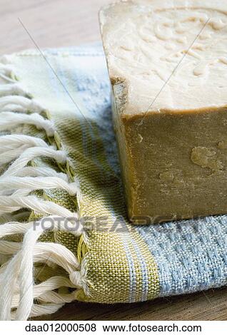 Bar of soap and towel View Large Photo Image Stock Photo - Bar of soap and towel. Fotosearch