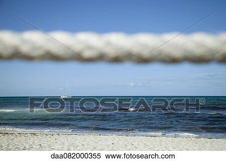 Beach scene, rope in foreground View Large Photo Image Stock Photography - Beach scene, rope in foreground. Fotosearch