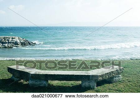 Bench overlooking coast View Large Photo Image Stock Photo - Bench overlooking coast. Fotosearch