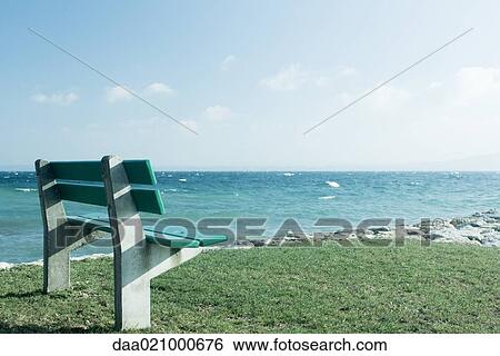 Bench overlooking coast View Large Photo Image Stock Photograph - Bench overlooking coast. Fotosearch
