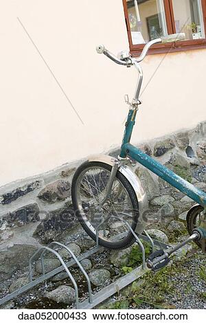Stock Image - Bicycle parked on bicycle rack. Fotosearch