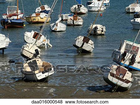 Stock Photo - Boats at low tide. Fotosearch