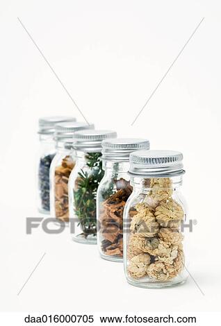 Bottles containing dried flowers, herbs, and wood shavings View Large Photo Image Stock Photography - Bottles containing dried flowers, herbs, and wood shavings. Fotosearch