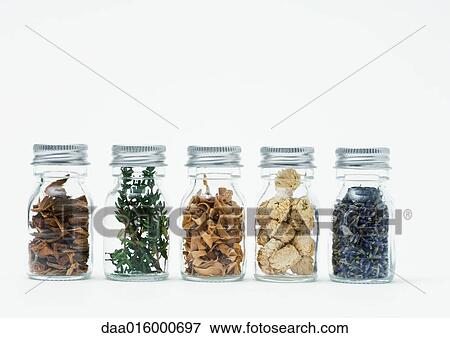 Bottles of dried flowers, herbs and wood shavings View Large Photo Image Stock Photo - Bottles of dried flowers, herbs and wood shavings. Fotosearch