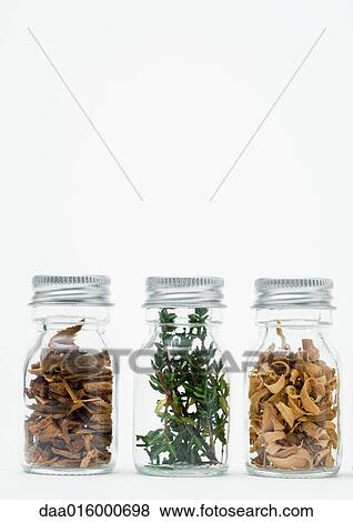 Bottles of dried flowers, herbs and wood shavings View Large Photo Image Stock Photo - Bottles of dried flowers, herbs and wood shavings. Fotosearch