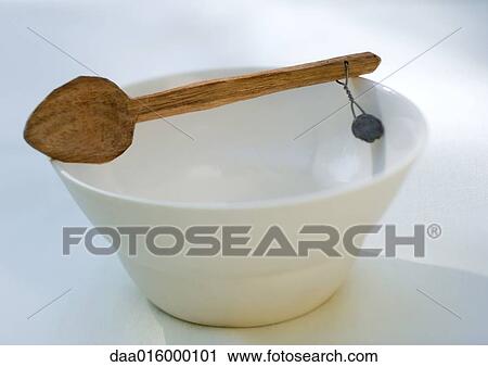 Bowl and wooden spoon View Large Photo Image Stock Image - Bowl and wooden spoon. Fotosearch