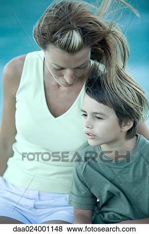 Boy and mother sitting in wind, portrait View Large Photo Image Stock Photo - Boy and mother sitting in wind, portrait. Fotosearch