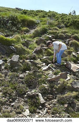 Boy exploring hillside View Large Photo Image Stock Image - Boy exploring hillside. Fotosearch