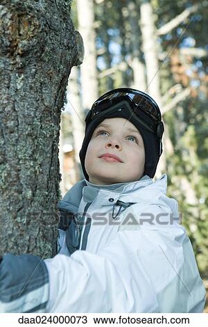 Boy hugging tree View Large Photo Image Stock Image - Boy hugging tree. Fotosearch