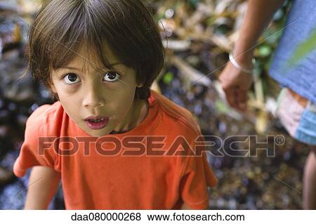 Boy looking at camera with awed expression View Large Photo Image Stock Photo - Boy looking at camera with awed expression. Fotosearch