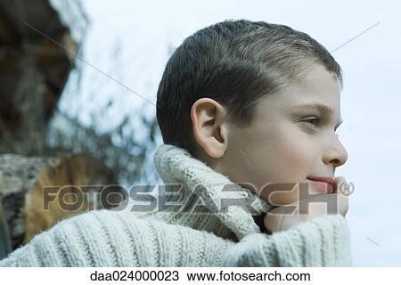 Boy wearing wool sweater, hand under chin View Large Photo Image Stock Image - Boy wearing wool sweater, hand under chin. Fotosearch