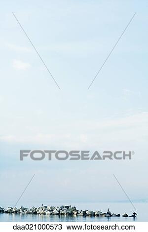 Breakwater on body of water View Large Photo Image Stock Image - Breakwater on body of water. Fotosearch