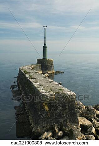Breakwater with beacon View Large Photo Image Stock Photo - Breakwater with beacon. Fotosearch