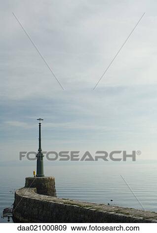 Breakwater with beacon View Large Photo Image Stock Photo - Breakwater with beacon. Fotosearch