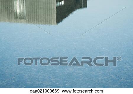 Building reflected in surface of water View Large Photo Image Stock Photo - Building reflected in surface of water. Fotosearch