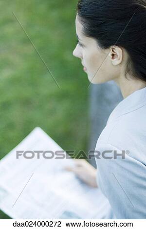 Businesswoman holding newspaper View Large Photo Image Stock Image - Businesswoman holding newspaper. Fotosearch