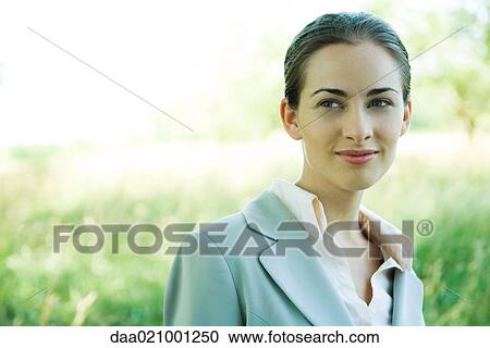Businesswoman standing outdoors, head and shoulders, smiling, portrait View Large Photo Image Stock Image - Businesswoman standing outdoors, head and shoulders, smiling, portrait. Fotosearch