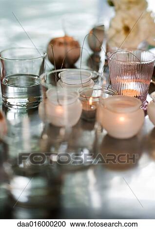 Stock Image - Candles in candleholders. Fotosearch