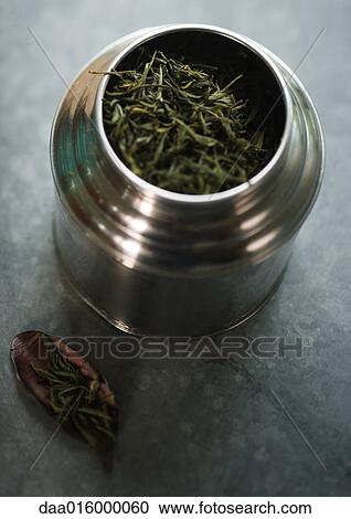 Canister full of green tea leaves View Large Photo Image Stock Image - Canister full of green tea leaves. Fotosearch