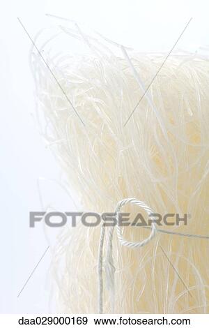 Cellophane noodles tied with string, close-up View Large Photo Image Stock Photo - Cellophane noodles tied with string, close-up. Fotosearch