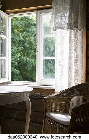 Chair and table by open window View Large Photo Image Stock Image - Chair and table by open window. Fotosearch
